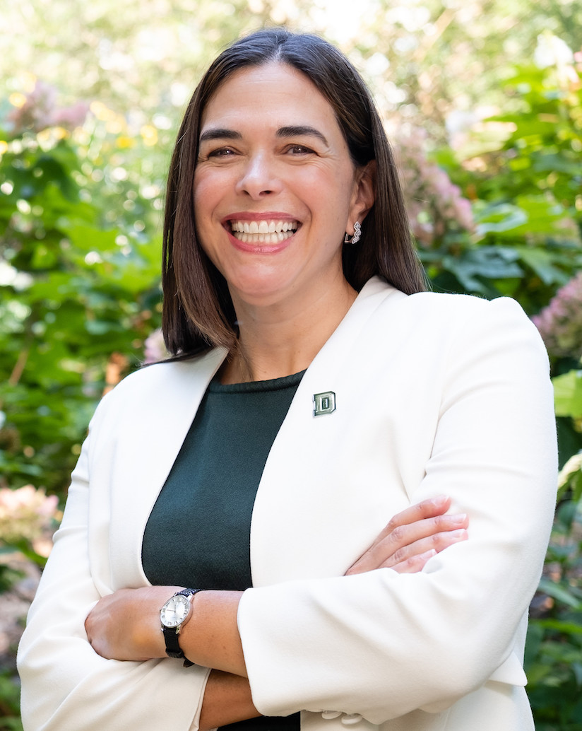portrait photo of a smiling Sian Leah Beilock wearing a D lapel pin
