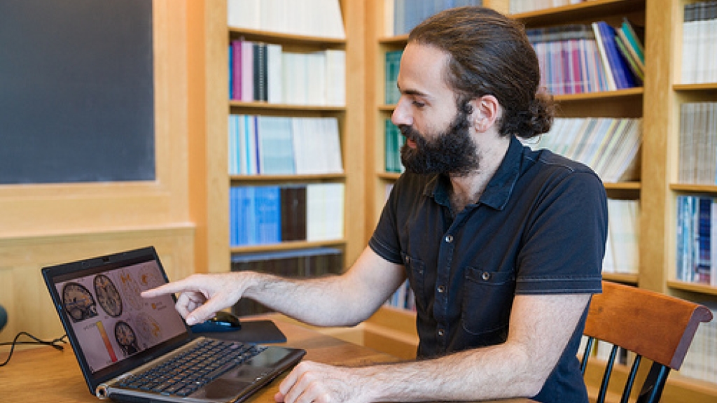 Dartmouth graduate student Alex Schlegel reviews brain scans to elucidate the changes in white matter during the process of learning.